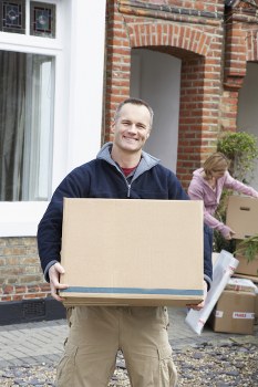 Moving boxes and furniture being loaded for a Streatham flat move