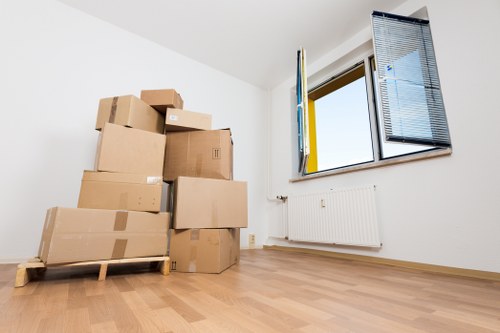 Removal crew loading boxes and desks for a business relocation