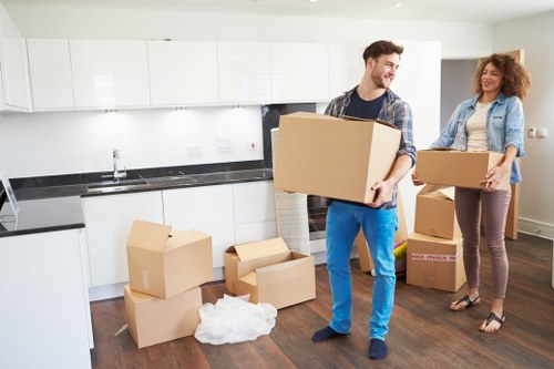 Packed moving boxes and furniture prepared for a local Streatham relocation
