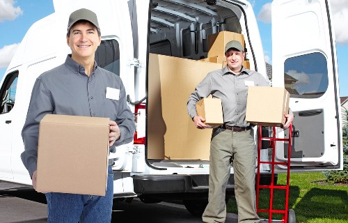 Local removal service handling furniture in a South London apartment
