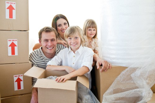 Removal team preparing furniture for transport in Streatham