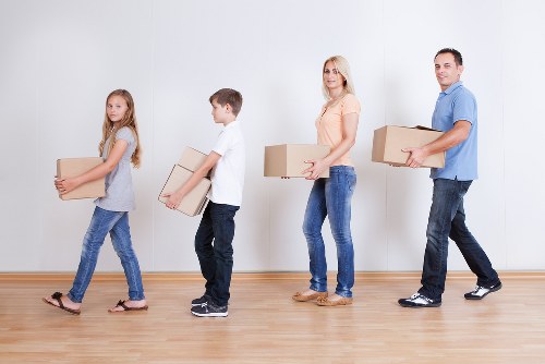 Furniture and boxes being carefully loaded into a removal van
